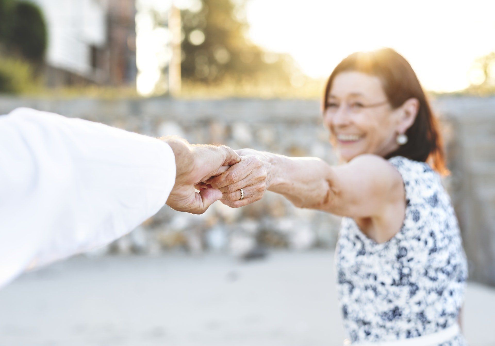 Elderly Couple Holding Hands on Beach