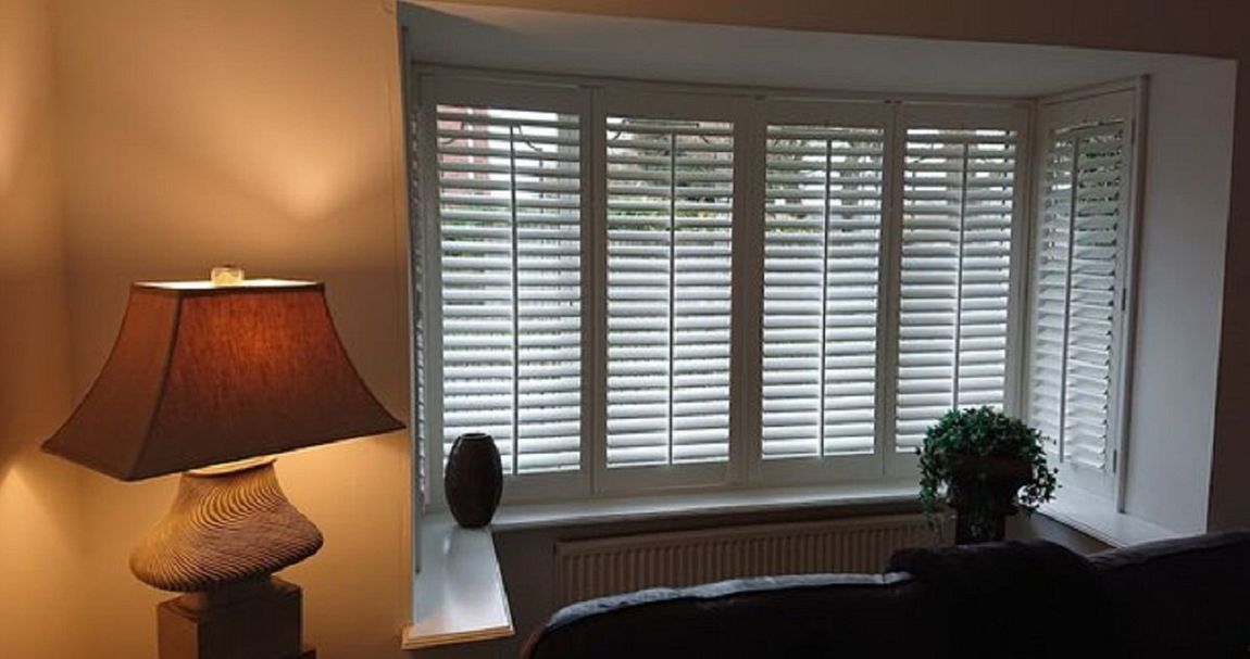 Sutton Coldfield Plantation shutters Bay Window Full height shutters 64 mm Slats Mid tilt bar