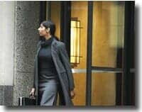 Woman exiting a door — Building Access Systems in Pasco, WA Woman exiting a door — Building Access Systems in Pasco, WA