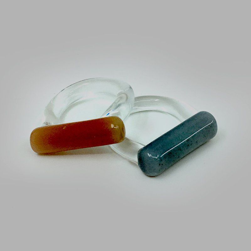 two glass rings featuring cyl glass heads