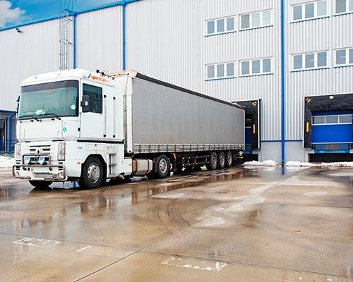 Women’s Apparel Stretch Garment — Unloading Big Container Trucks in Los Angeles, CA Women’s Apparel Stretch Garment — Unloading Big Container Trucks in Los Angeles, CA