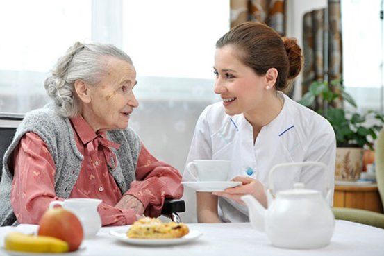 Senior Woman Eats Lunch — Uniontown, PA — Pento Homecare Agency Senior Woman Eats Lunch — Uniontown, PA — Pento Homecare Agency