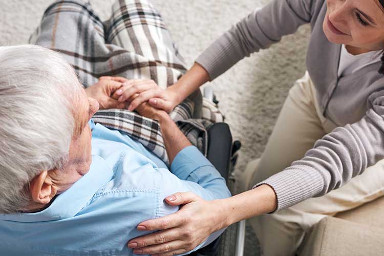 Caregiver Sitting Beside Senior Man — Uniontown, PA — Pento Homecare Agency