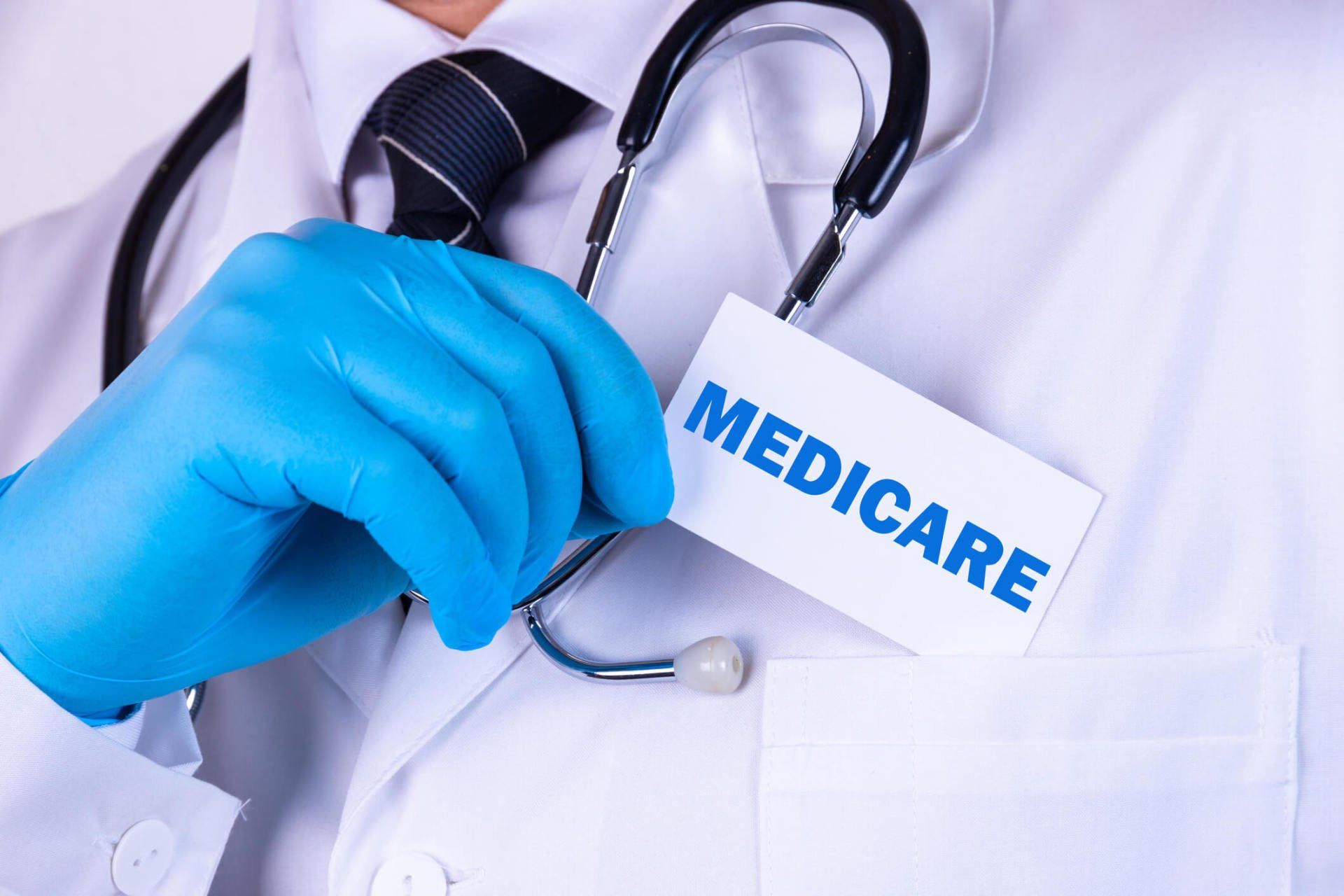 Doctor Holding a Card — Hot Springs, AR — Linda Morrison Insurance