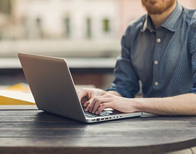 Individual working on laptop after availing the services from Mckersey IT