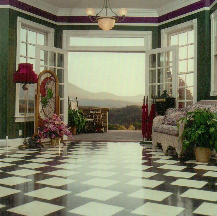 A living room with a checkered floor and a couch
