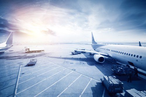 A large passenger jet is parked on the tarmac at an airport.