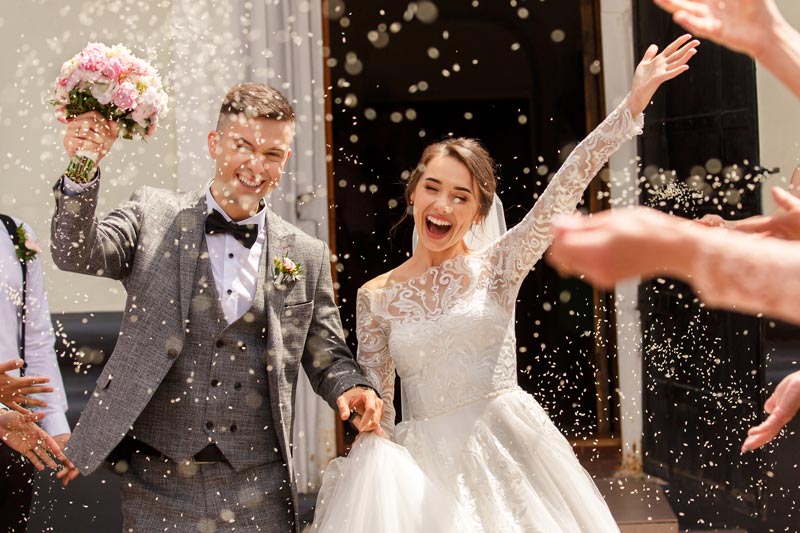 couple walking outside after their wedding ceremony