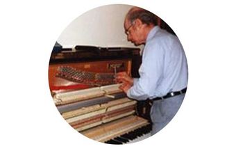 man-fixing-piano man-fixing-piano