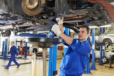 auto mechanic at car suspension repair work - car maintenance in Pueblo CO auto mechanic at car suspension repair work - car maintenance in Pueblo CO