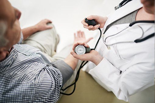 doctor checking bp