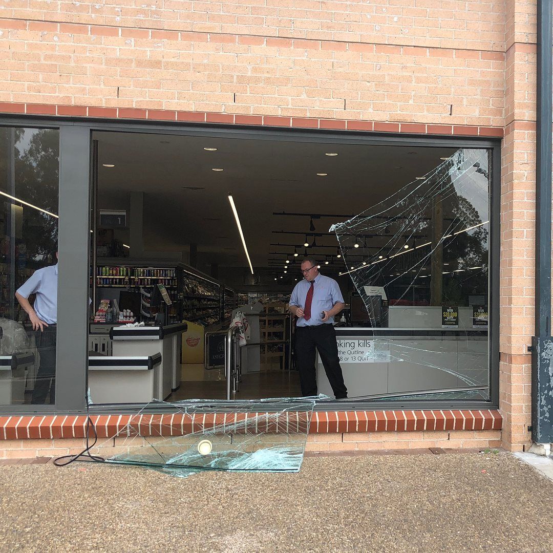 Broken window glass being repaired by Aussie Emergency Glass, experts in glass replacement and repair services.