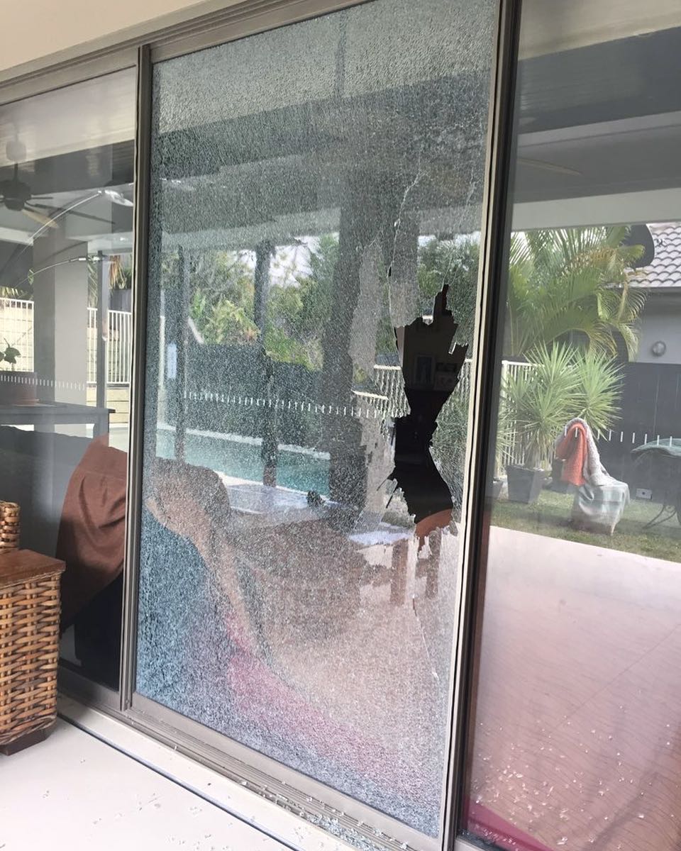 A damaged glass door before replacement by Aussie Emergency Glass, trusted for expert glass repair.