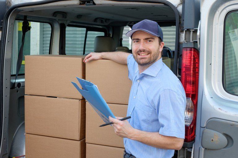 Person Holding Boxes — Arlington, TX — Pronto Courier Delivery and Logistics