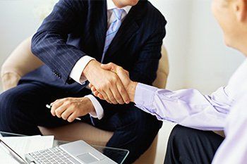 Accountant shaking hands with a mid adult man in — Income Tax Leesburg, FL Accountant shaking hands with a mid adult man in — Income Tax Leesburg, FL