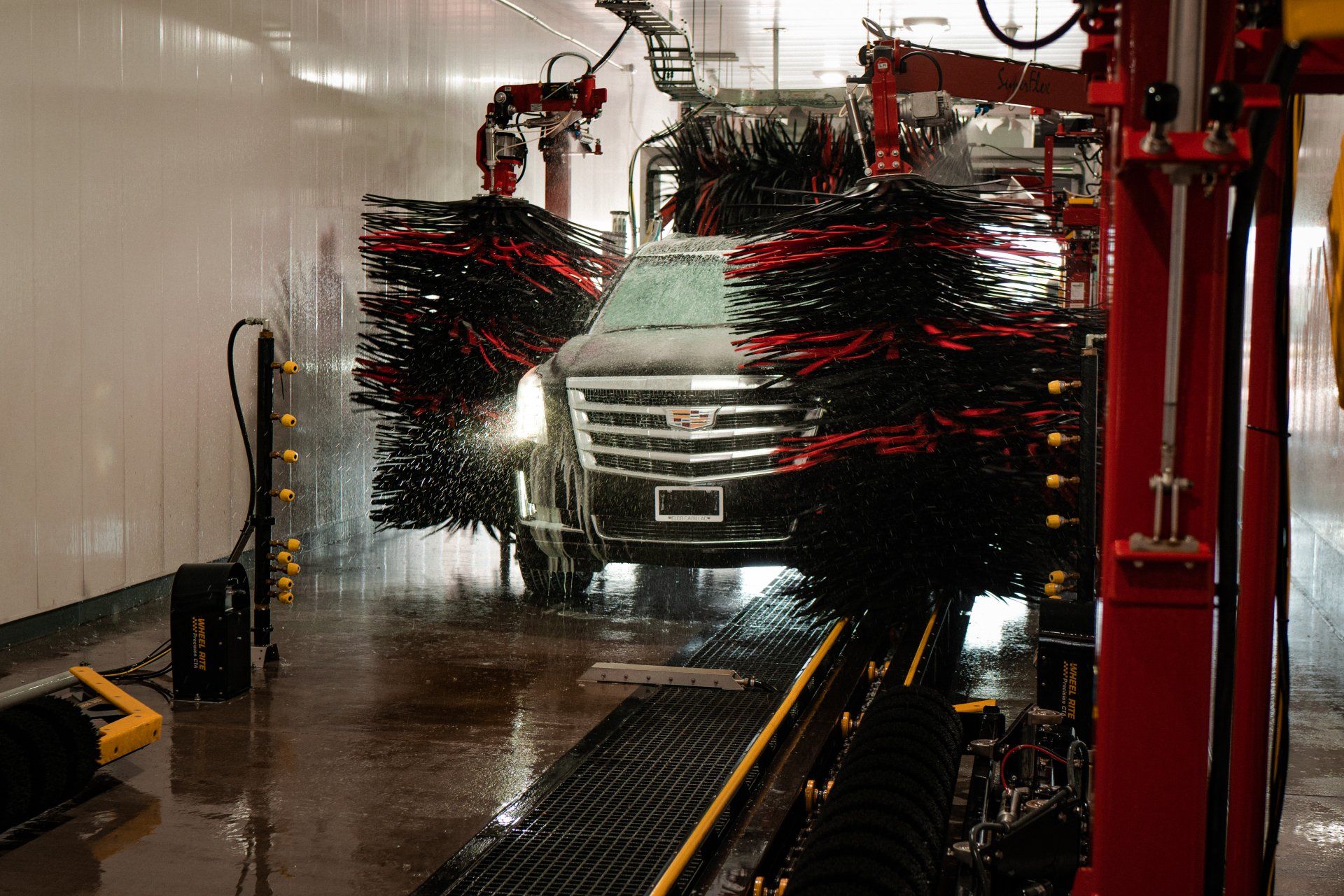 Cadillac Escalade in tunnel of Gas Mart Car Wash