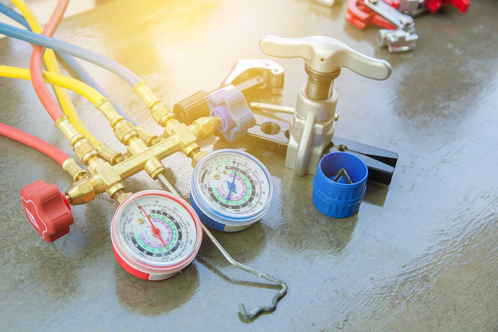 Air Conditioning Technician. manometers measuring equipment for filling air conditioners,gauges.