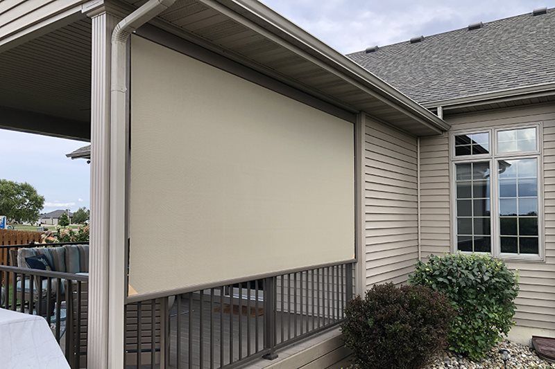 A house with a screen on the side of it
