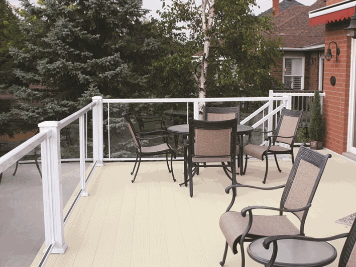 A deck with a table and chairs on it