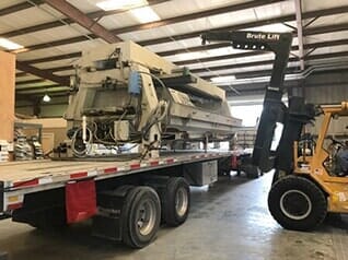 Forklift and Equipment on Flatbed - Rigging Contractor in Tampa, FL Forklift and Equipment on Flatbed - Rigging Contractor in Tampa, FL