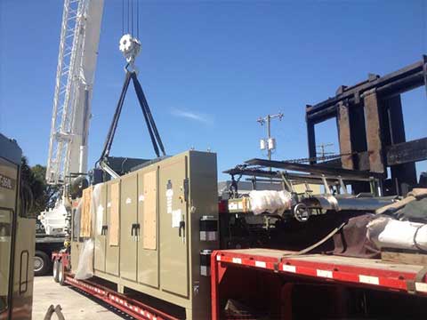 Using Crane to Place Equipment on Flatbed - Rigging Contractor in Tampa, FL