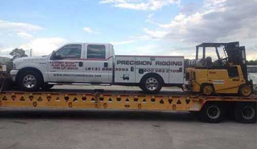 Truck and Forklift on Flatbed - Rigging Contractor in Tampa, FL Truck and Forklift on Flatbed - Rigging Contractor in Tampa, FL
