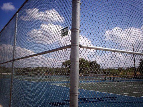 Silver Chain Link Fence In Court — San Antonio, TX — Alamo Fence Company of San Antonio, Inc.