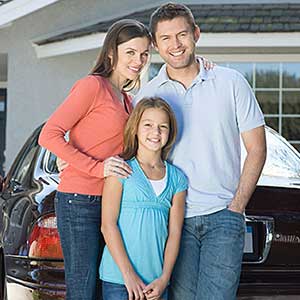 Family outside house—home insurance in County, MN Family outside house—home insurance in County, MN