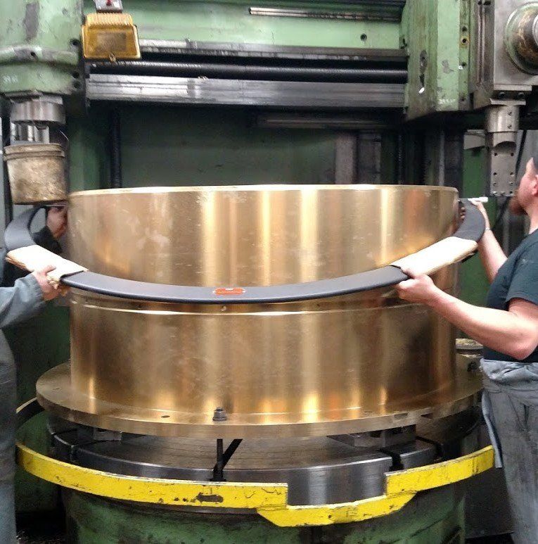 Two Technicians Removing Mechanical Parts — in Billings, MT — S & S Machine Inc