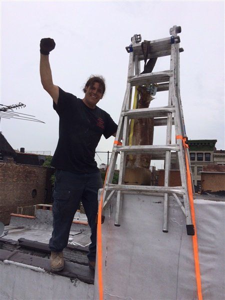 owner tommy reek on ladder