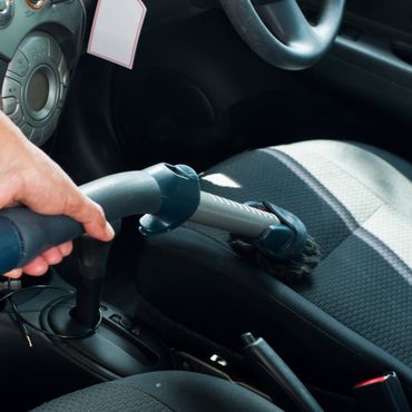 Cleaning car interior with vacuum