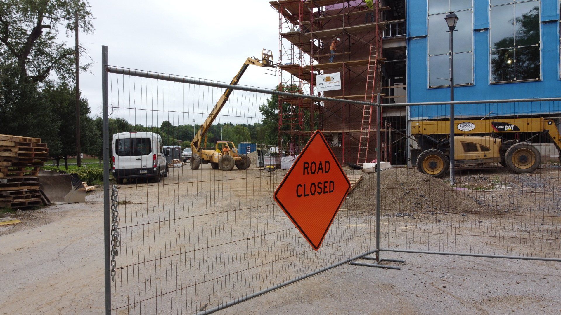 A construction site with a sign that says road closed
