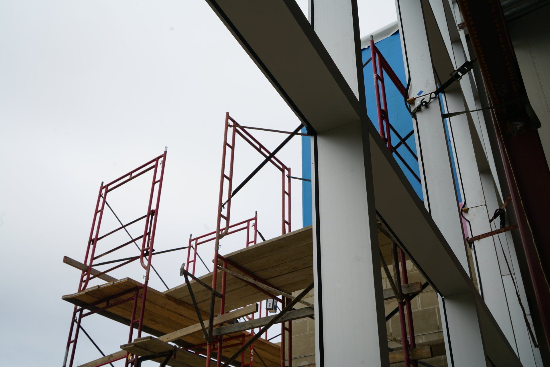 A building under construction with scaffolding on the side of it404