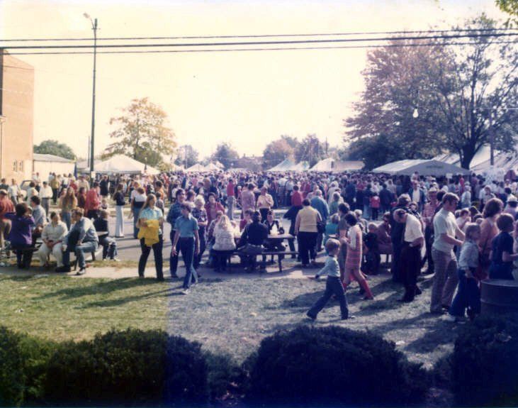 Crowd of people out celebrating Oktoberfest.