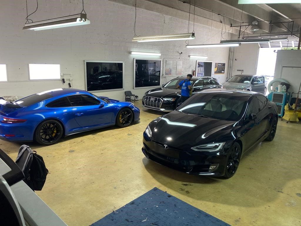 Cars In Window Tinting Shop — Miami, FL — Solar Tint, Inc.