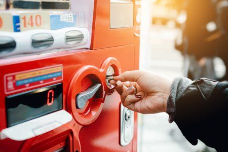 Vending Machine Company Charlotte, NC — Woman Inserting Coin in Charlotte, NC Vending Machine Company Charlotte, NC — Woman Inserting Coin in Charlotte, NC