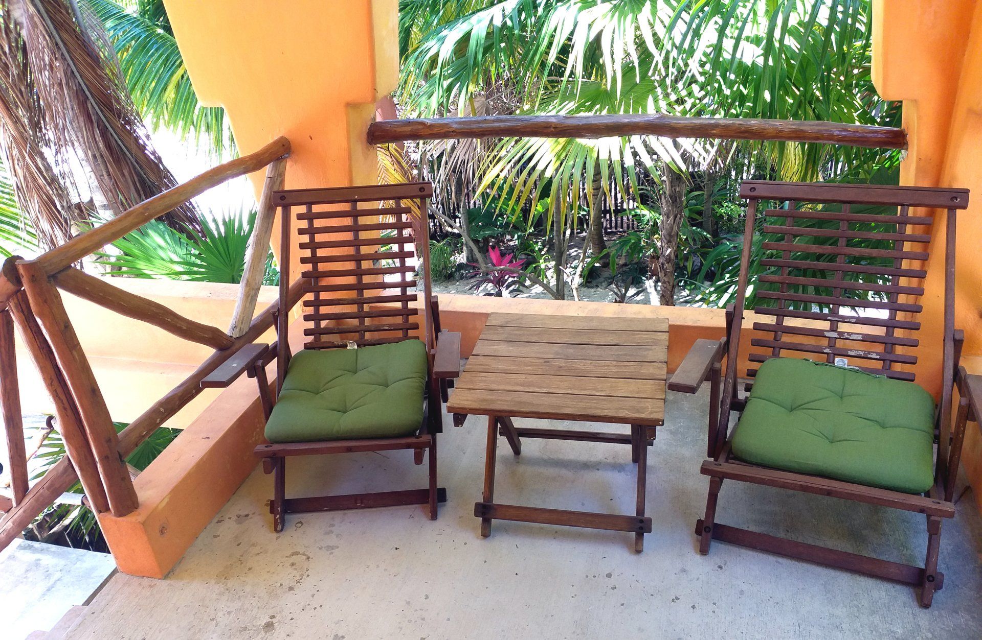 Small patio with two chairs and table  - jungle view