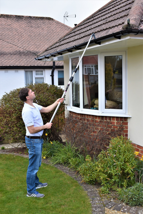 Cleaning gutters from the ground