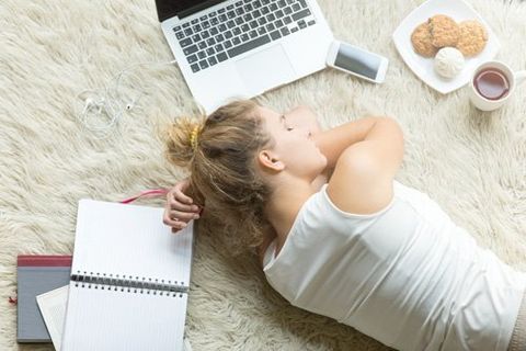 Women sleeping on a carpet in Wigan