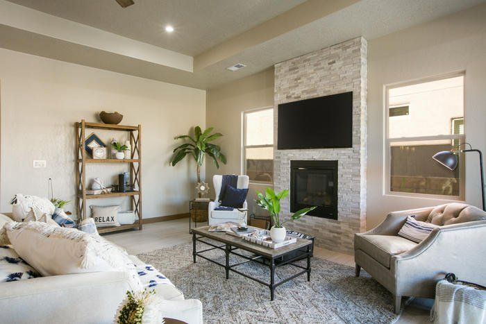 A living room filled with furniture and a fireplace.