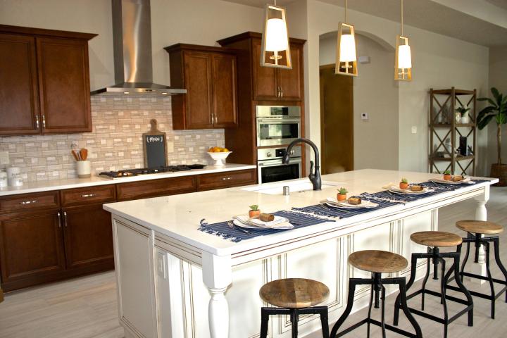 A kitchen with a large island and stools