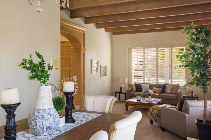 A living room with a table and chairs and a couch