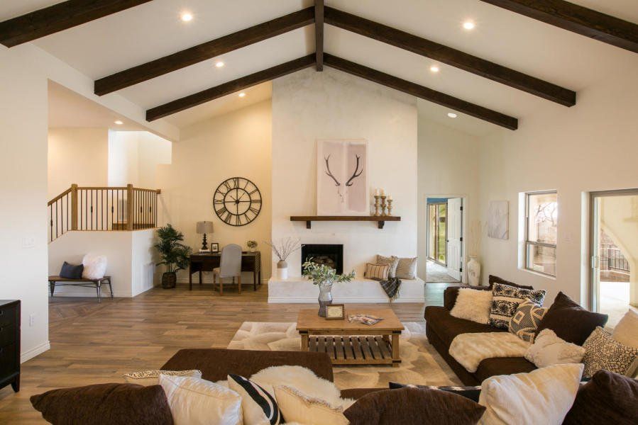 A living room filled with furniture and a fireplace.