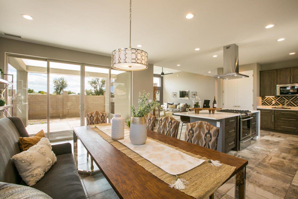 A living room with a dining table and a couch.