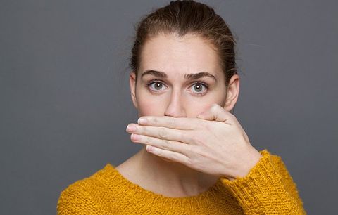 Woman Covering Her Mouth — Clarkston, MI — Mark Frenchi DDS Woman Covering Her Mouth — Clarkston, MI — Mark Frenchi DDS