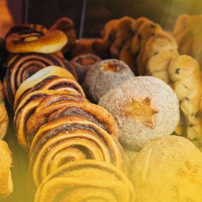 A bunch of different types of pastries are on a table