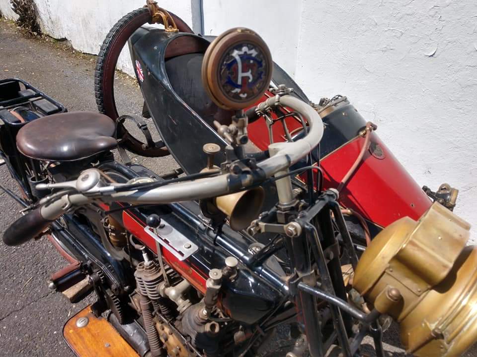 A red and black motorcycle with the letter f on the front