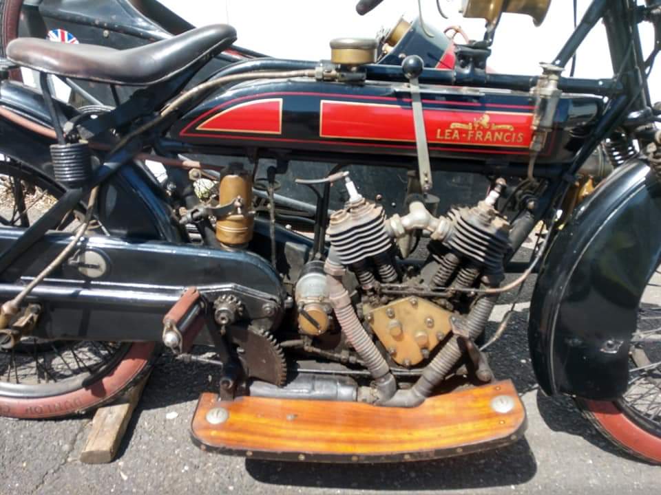 A black and red motorcycle is parked on the side of the road