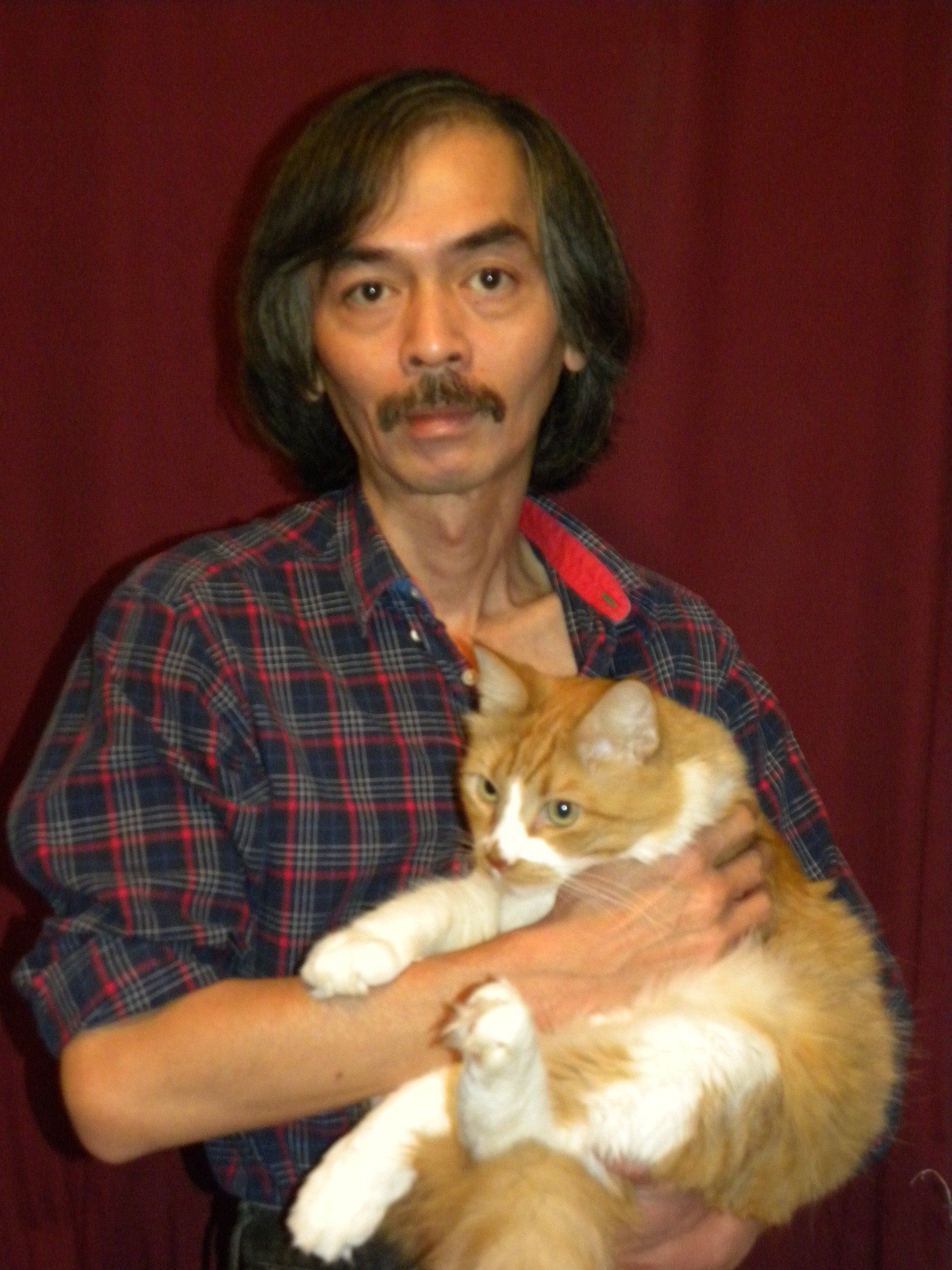 Minh Le with cat