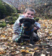 Young Boy with Dog — Whittier, CA — Trinity Realty & Trinity Home Loans Inc.
